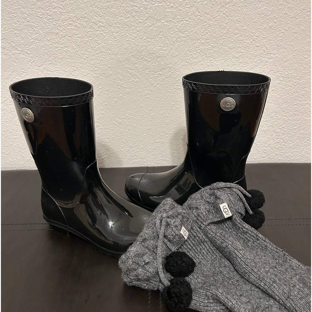 UGG rain boots, black with grey socks. Used good condition